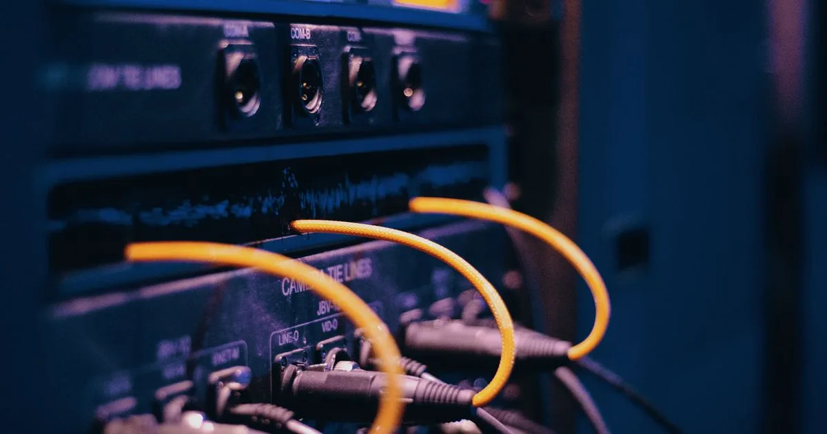 Close-up of rack-mounted network hardware with connected cables