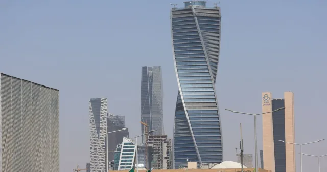 Modern office towers in the Riyadh skyline viewed from street level